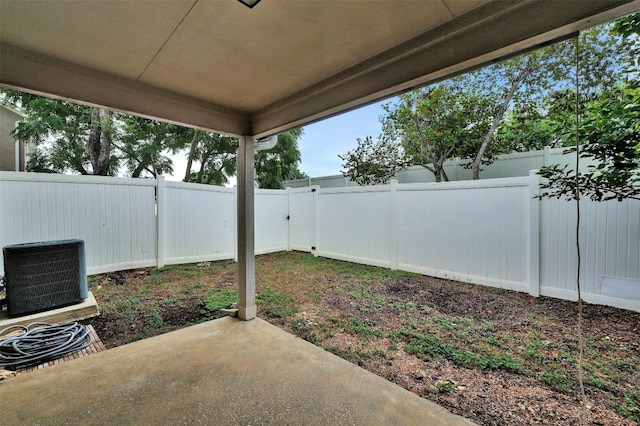 view of yard featuring a patio and central air condition unit