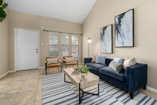 living room featuring high vaulted ceiling