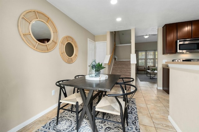 dining space featuring light tile patterned floors