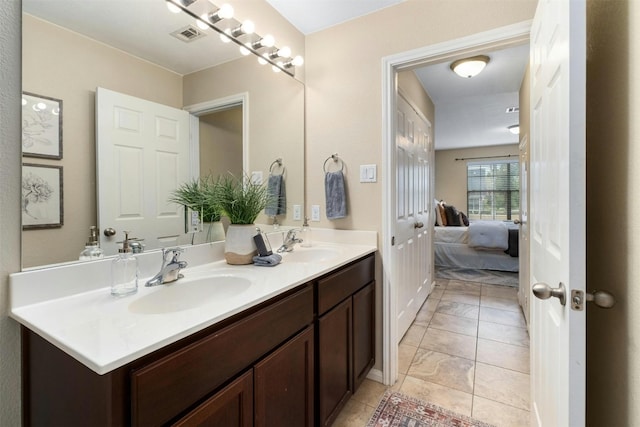 bathroom with vanity and tile patterned flooring