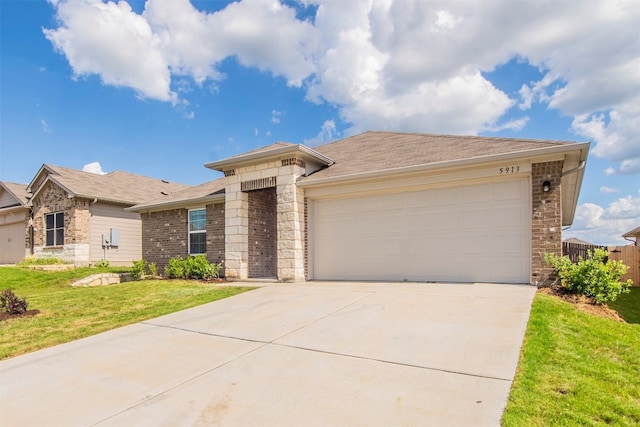 view of front of house with a garage and a front yard