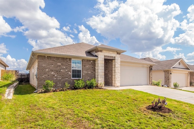 ranch-style home featuring a garage and a front lawn