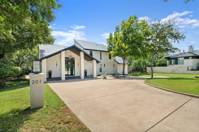 modern farmhouse with a front lawn