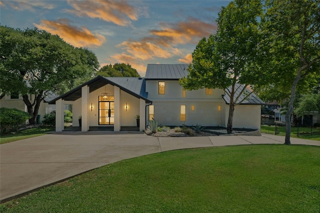 view of front facade featuring a yard and covered porch