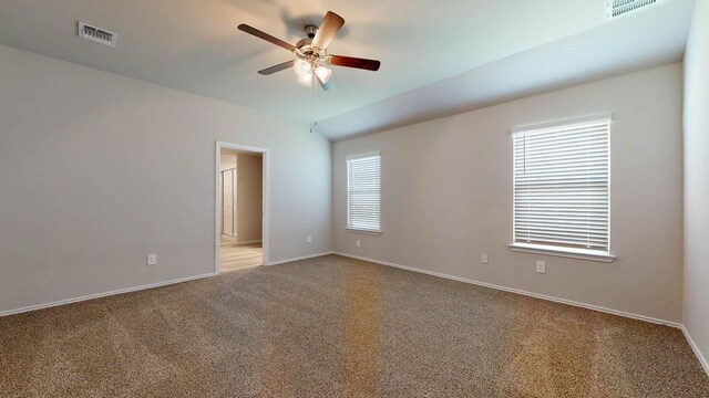 carpeted spare room with ceiling fan