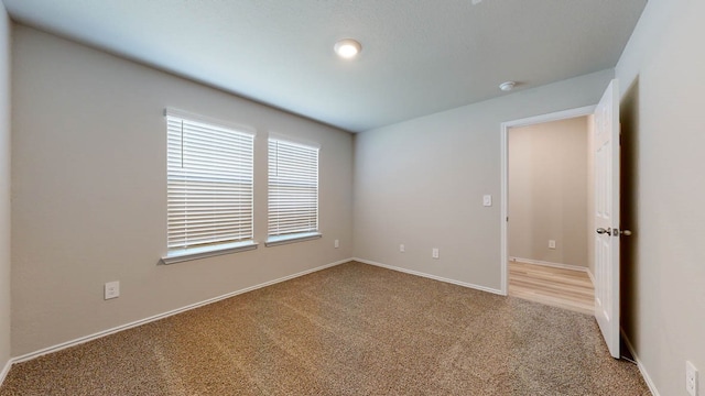 unfurnished room with carpet