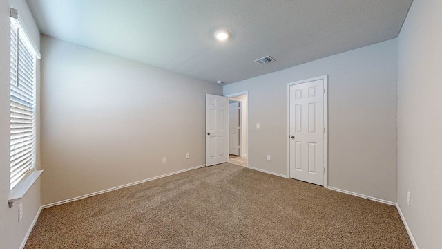 empty room with carpet flooring