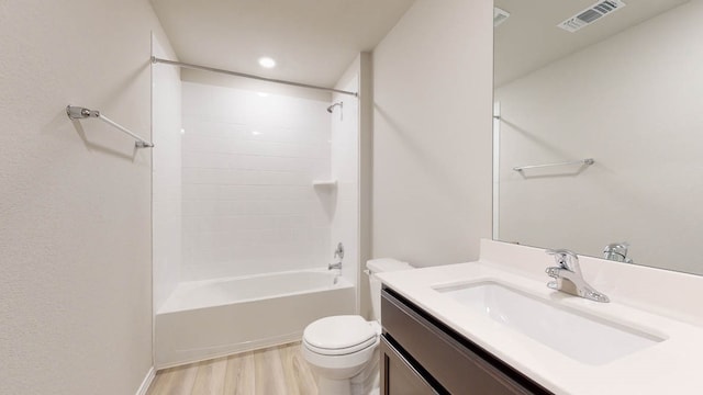 full bathroom with vanity, toilet, hardwood / wood-style floors, and  shower combination