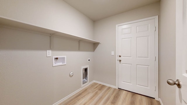 laundry room featuring light hardwood / wood-style flooring, hookup for a gas dryer, electric dryer hookup, and washer hookup