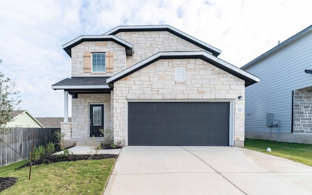 view of front of house featuring a front yard and a garage