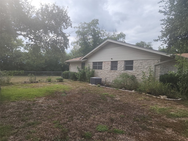 view of home's exterior featuring central AC unit