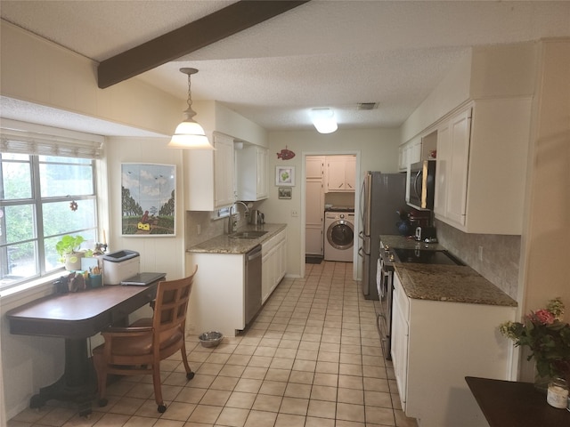 kitchen featuring beamed ceiling, hanging light fixtures, sink, white cabinetry, and appliances with stainless steel finishes