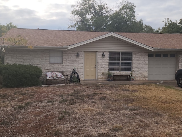 single story home featuring a garage