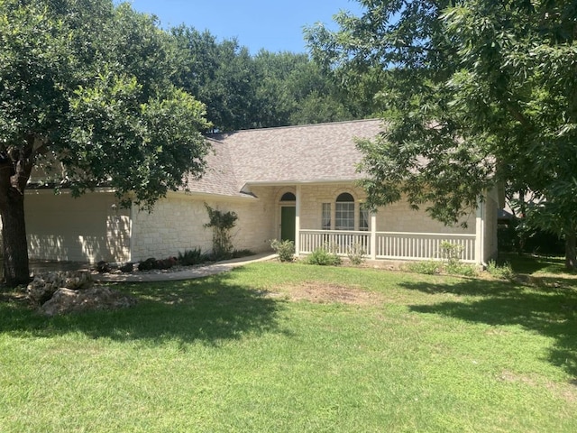 view of front facade with a porch and a front lawn