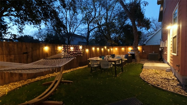 view of yard with a patio and central air condition unit