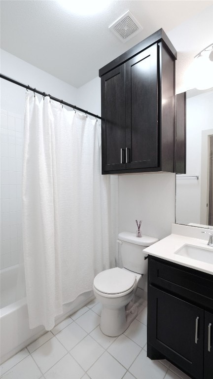 full bathroom with shower / bath combo, tile patterned floors, vanity, and toilet