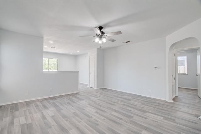 empty room featuring ceiling fan and light hardwood / wood-style floors