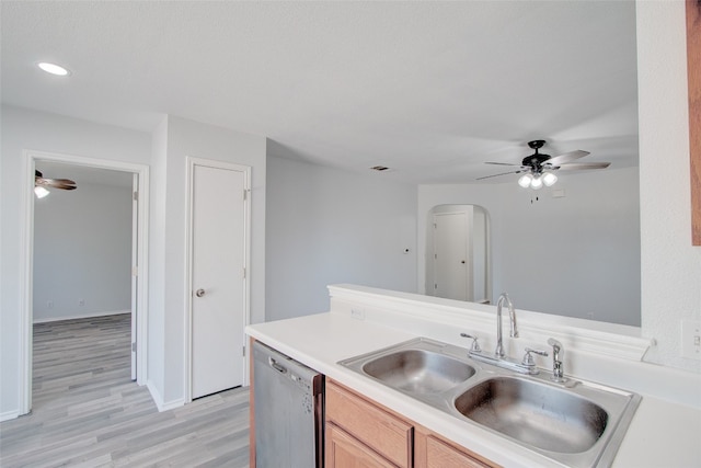 kitchen with light brown cabinetry, dishwasher, light hardwood / wood-style flooring, sink, and ceiling fan