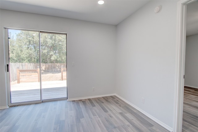 empty room with light hardwood / wood-style floors