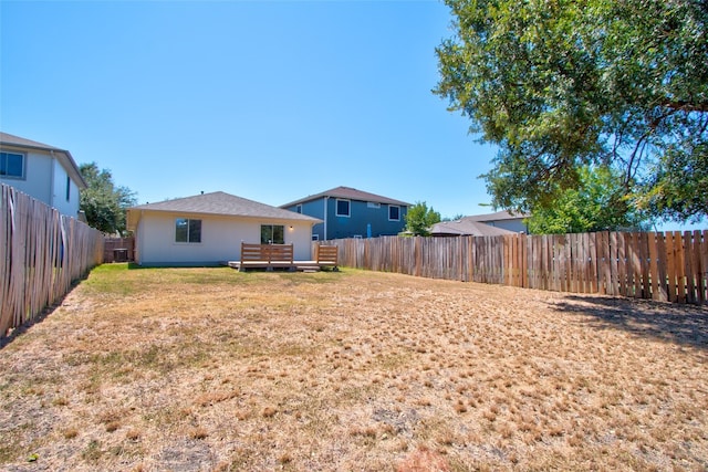 view of yard featuring a wooden deck