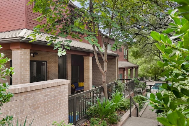 view of property exterior with brick siding