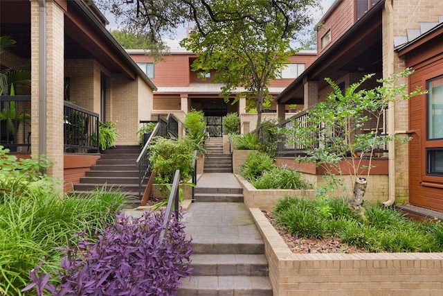 entrance to property featuring brick siding