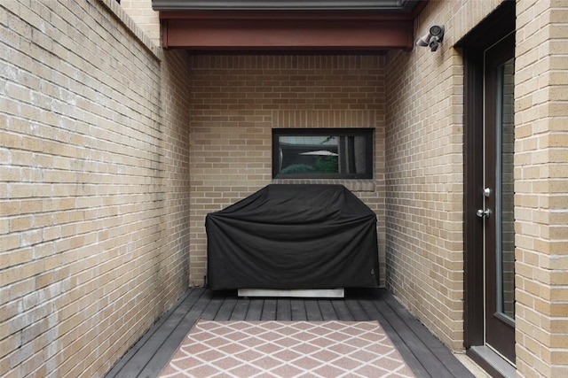 property entrance with brick siding