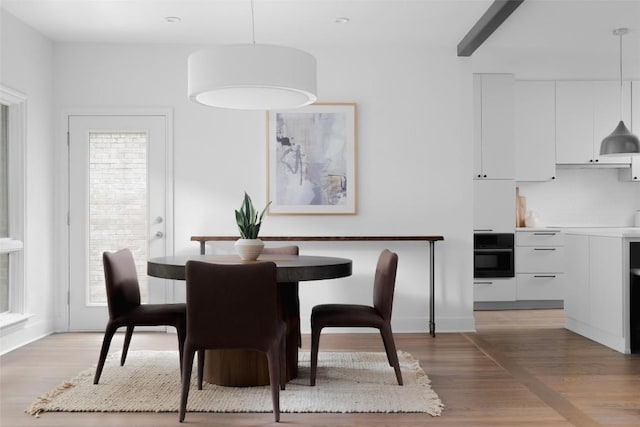 dining room with wood-type flooring