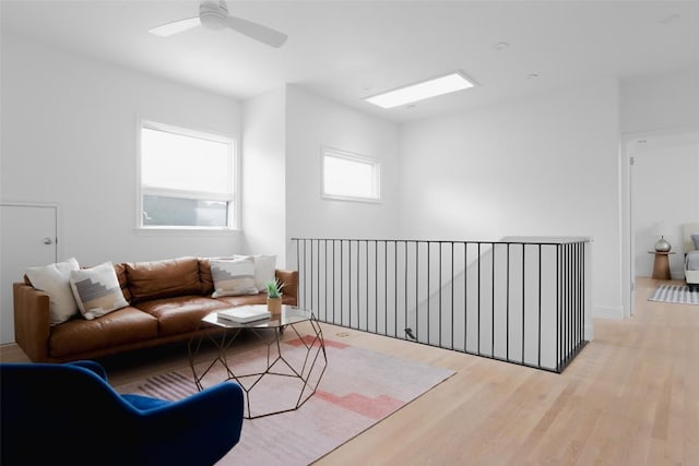 living room featuring ceiling fan and wood finished floors