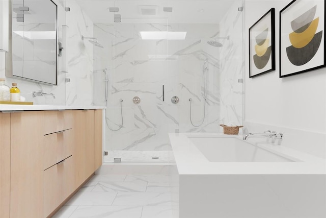 bathroom featuring an enclosed shower and vanity