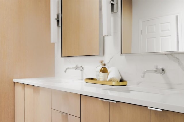 bathroom with double vanity and a sink