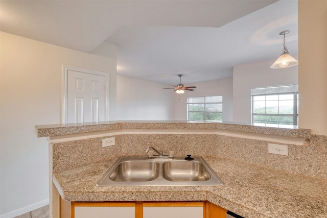 kitchen with ceiling fan and sink