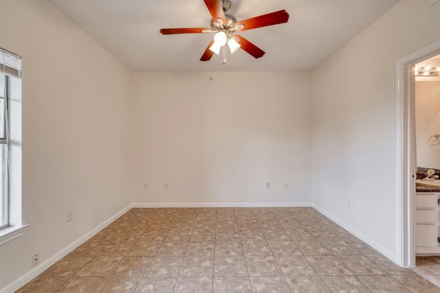 spare room with ceiling fan