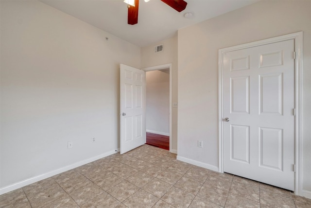 unfurnished bedroom featuring ceiling fan