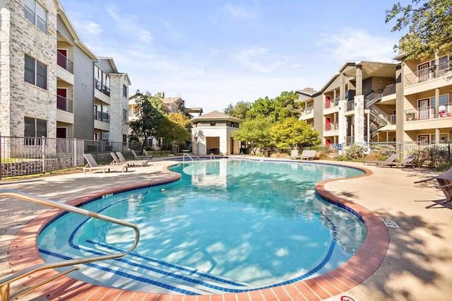 view of swimming pool with a patio