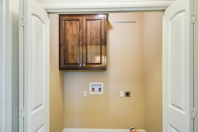 washroom featuring washer hookup, cabinets, and electric dryer hookup