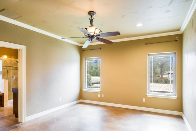 spare room featuring ornamental molding, light tile patterned floors, and ceiling fan