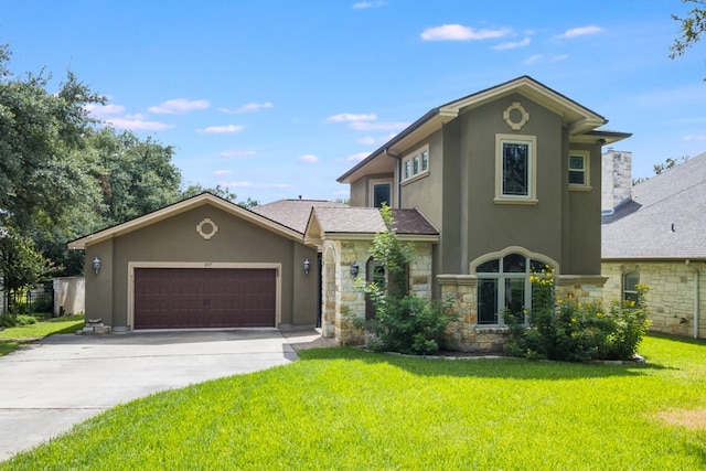 front facade featuring a garage and a front lawn