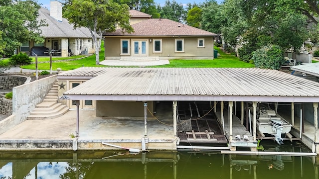 dock area featuring a yard and a water view