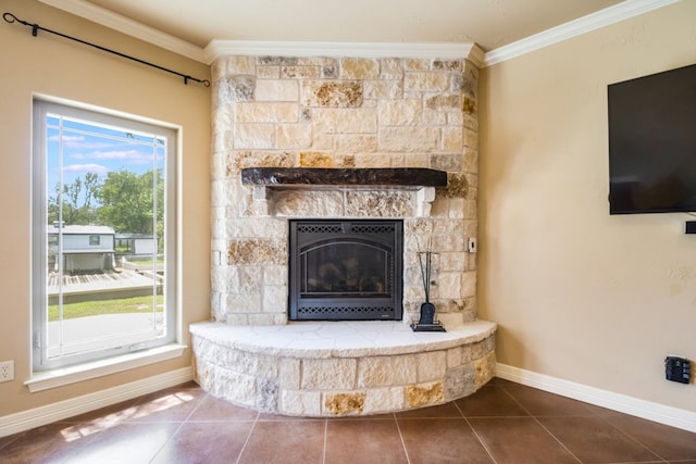 details with tile patterned flooring, a fireplace, and crown molding