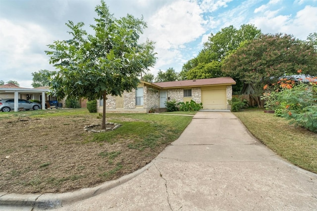 ranch-style house featuring a garage and a front lawn