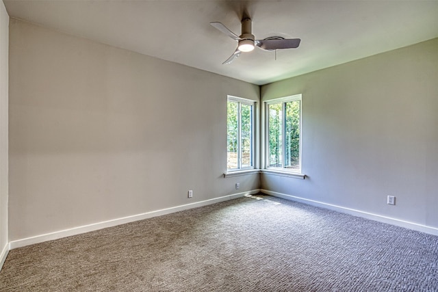 unfurnished room with ceiling fan and carpet floors