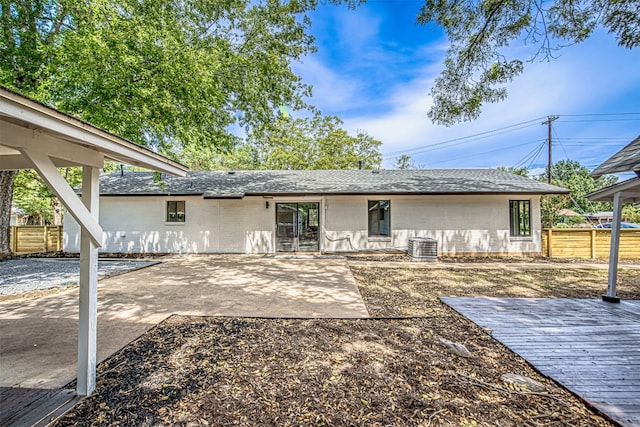 rear view of property featuring a patio area and a deck