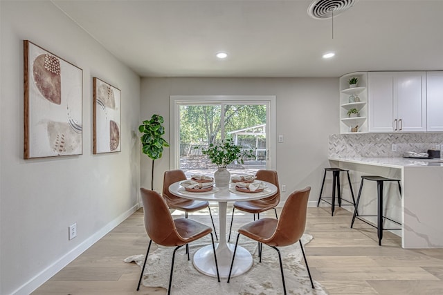 dining area with light wood-type flooring