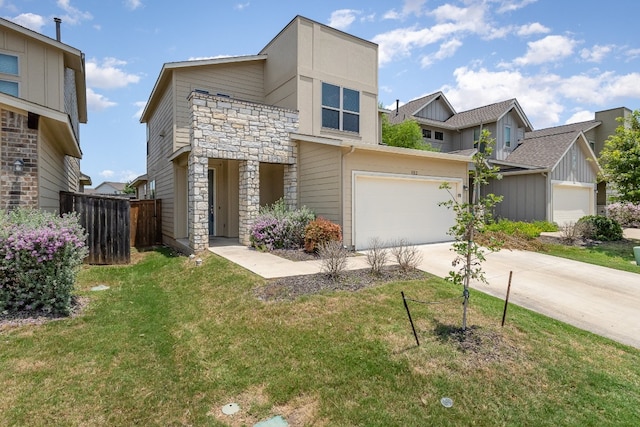 view of front facade featuring a garage and a front lawn