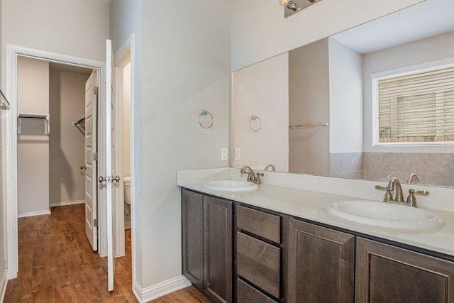 bathroom featuring vanity and hardwood / wood-style flooring