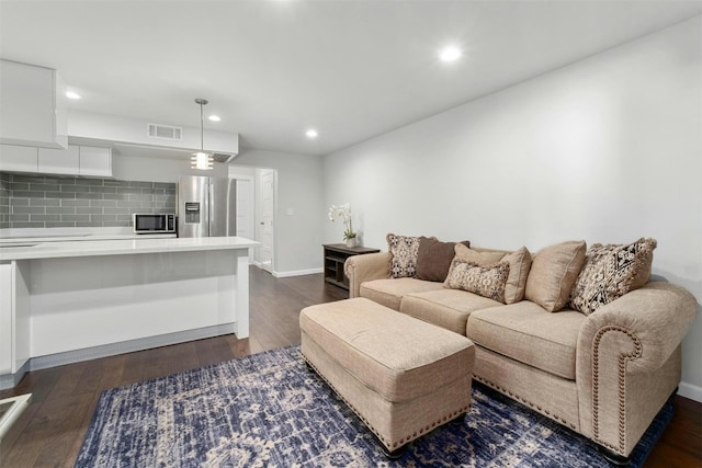 living room featuring dark hardwood / wood-style floors