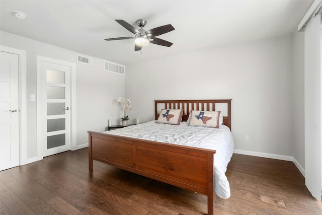 bedroom with dark wood-type flooring and ceiling fan