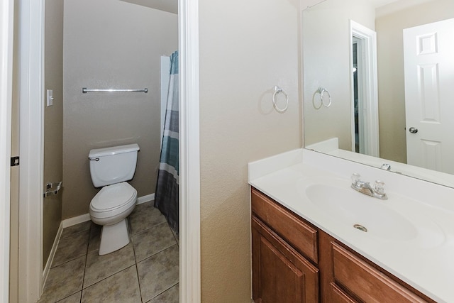 bathroom featuring tile patterned floors, vanity, curtained shower, and toilet