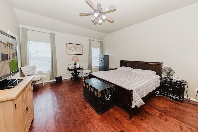 bedroom with ceiling fan, dark hardwood / wood-style flooring, and lofted ceiling